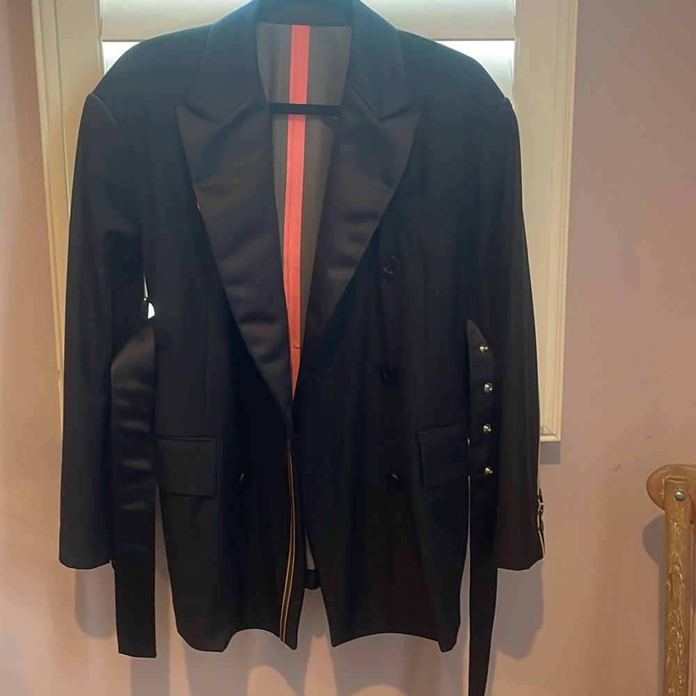 Brand new sacai coat. Also it is waterproof for rain. Size 1.